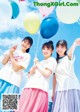 A group of young women holding colorful balloons in their hands.